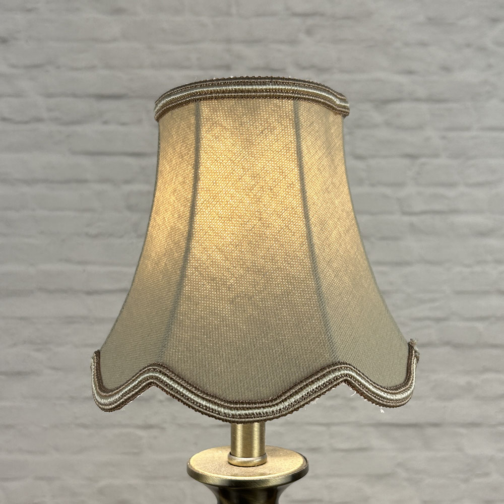 Fawn scalloped chandelier shade in brushed cotton lit showing soft neutral tone and oyster soutache trim