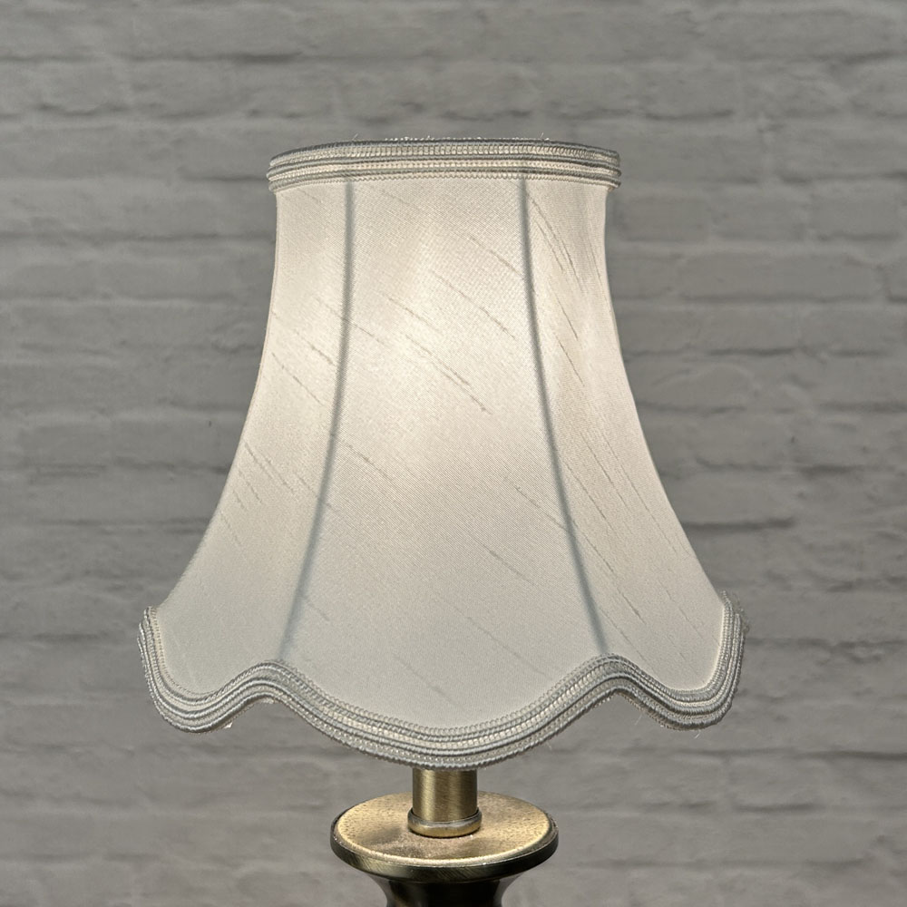 Natural scalloped chandelier shade in faux silk lit showing warm tone and matching soutache trim