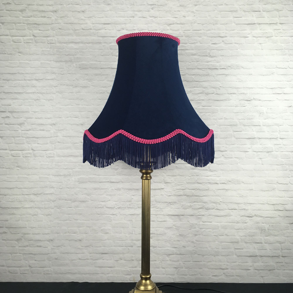 Navy velvet scalloped bowed empire lampshade with hot pink feather trim on table lamp