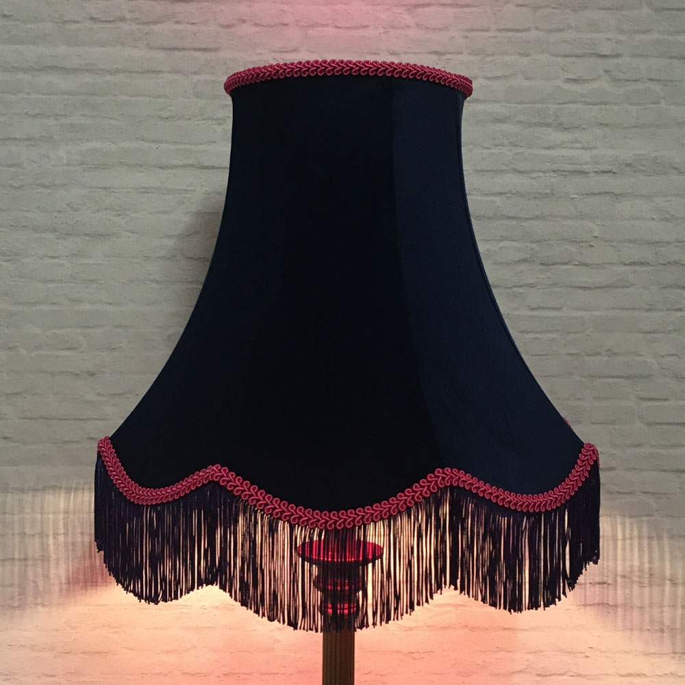 Navy velvet scalloped bowed empire lampshade with hot pink feather trim on floor lamp