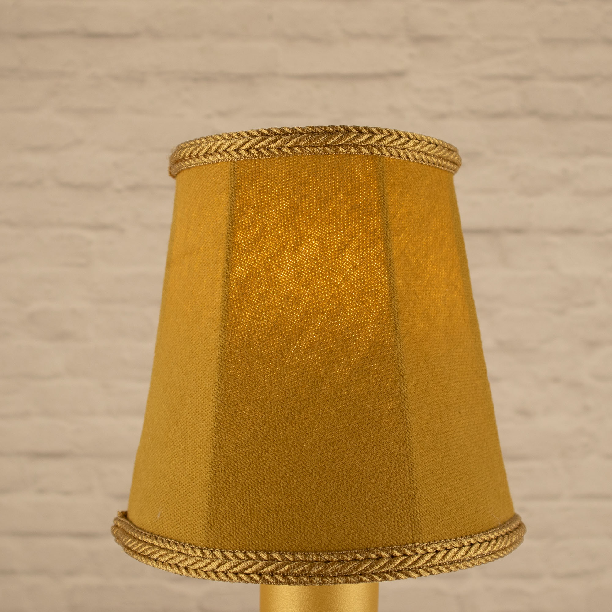 Lit old gold empire brushed cotton candle shade with matching rope trim