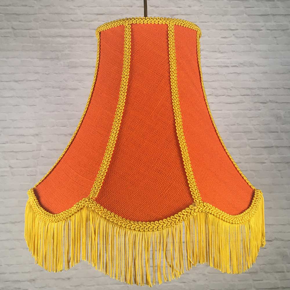 Orange hessian scalloped bowed empire pendant lampshade with yellow trim, yellow fringe and orange lining