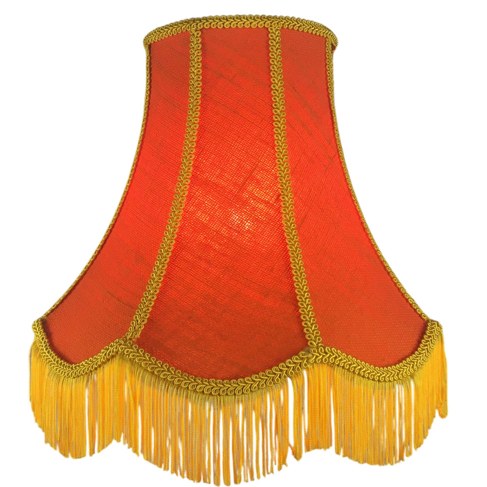 Illuminated orange hessian scalloped bowed empire lampshade with yellow trim, yellow fringe and orange lining