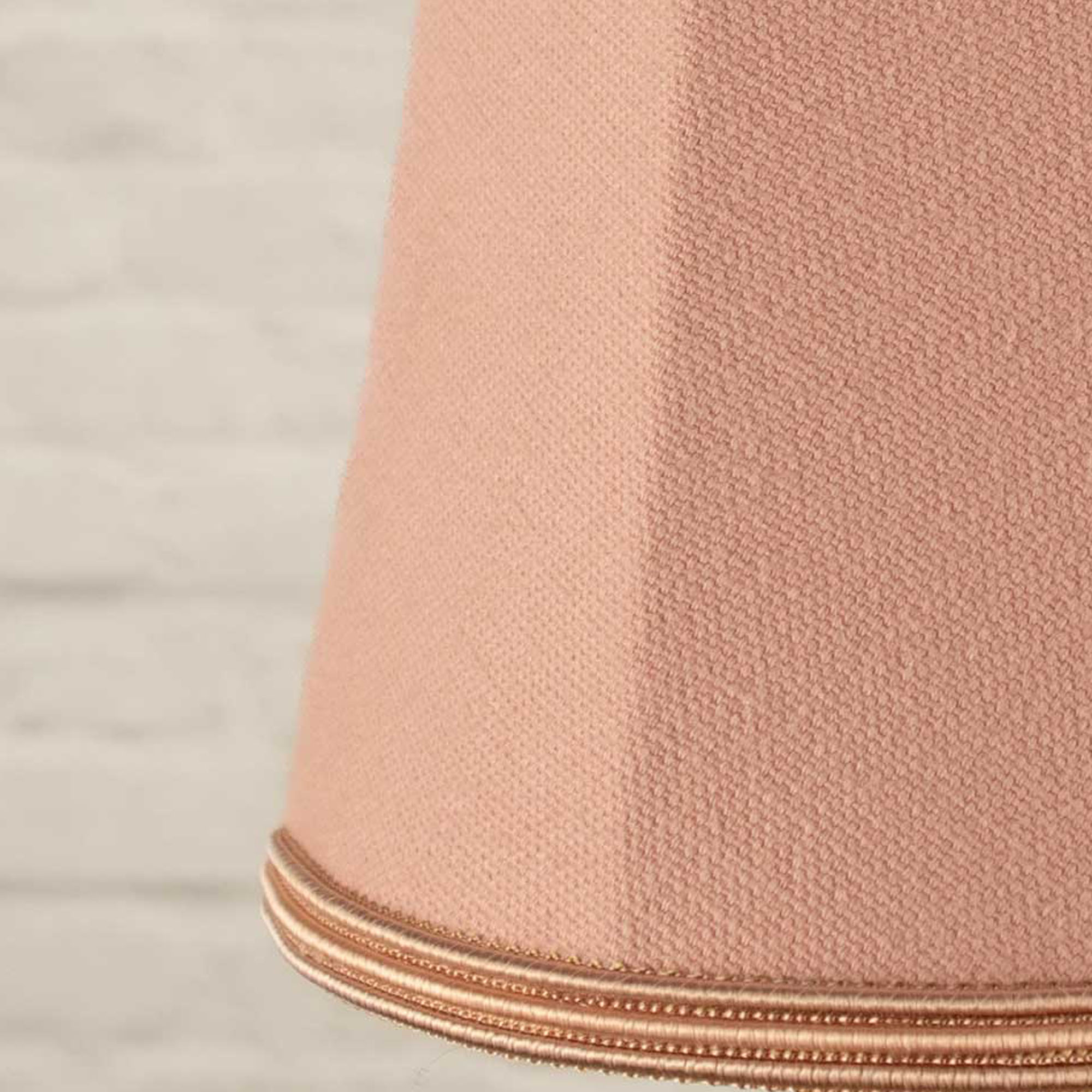 Close-up of pale pink brushed cotton fabric and matching soutache trim on empire candle shade