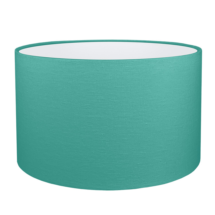 A teal drum lampshade with white PVC lining