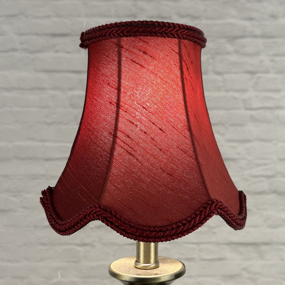 Ruby scalloped chandelier shade in faux silk lit showing rich red tone and rope trim