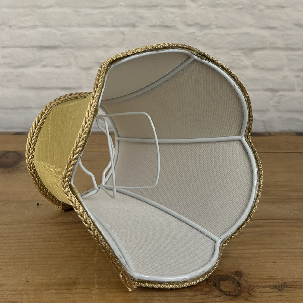 Interior view of scalloped chandelier shade showing curved frame shape and clip-on bulb fitting