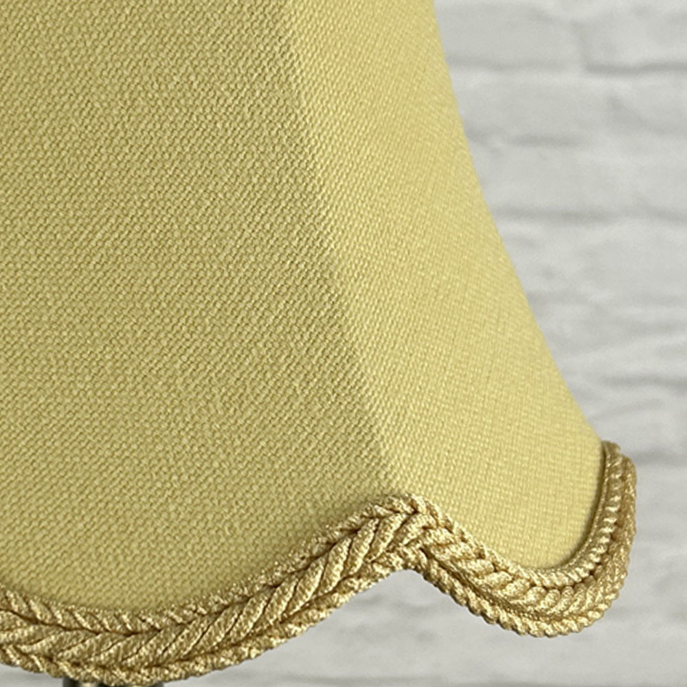 Close-up of soft gold brushed cotton scalloped chandelier shade with rope trim
