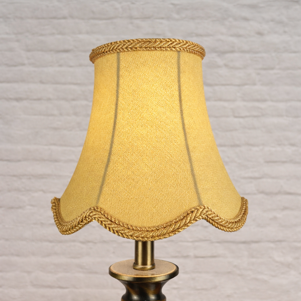 Soft gold scalloped chandelier shade in brushed cotton lit showing warm tone and rope trim