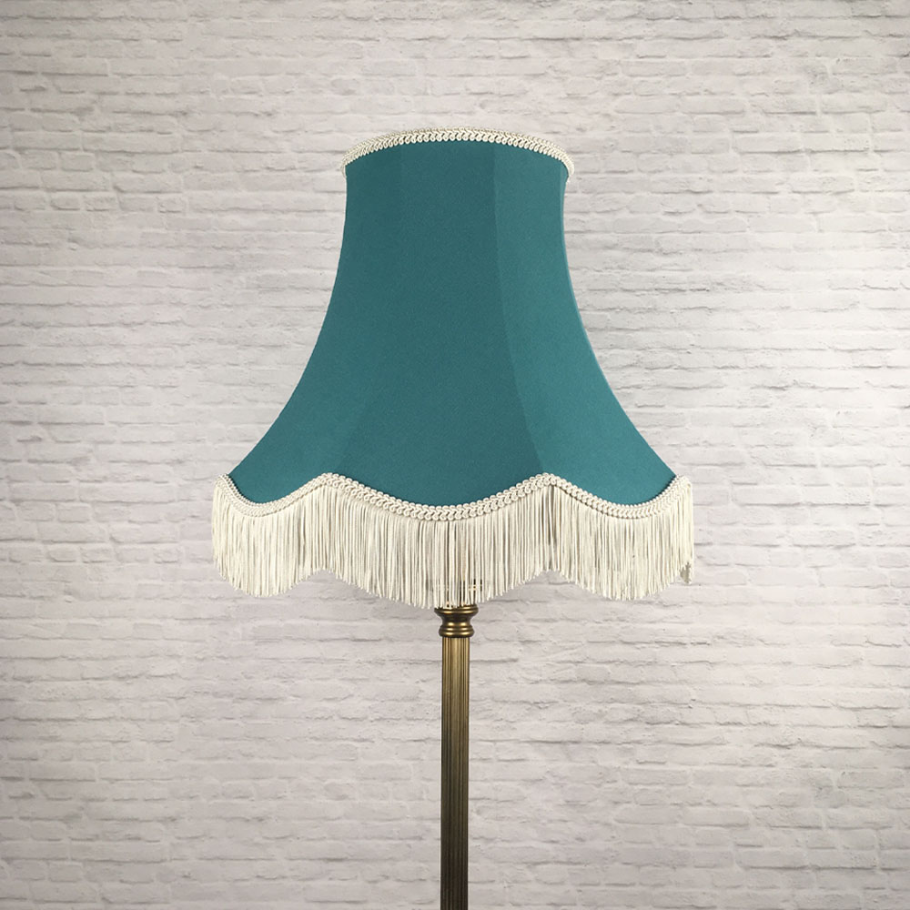 Teal brushed cotton scalloped bowed empire lampshade with dark cream feather trim on table lamp