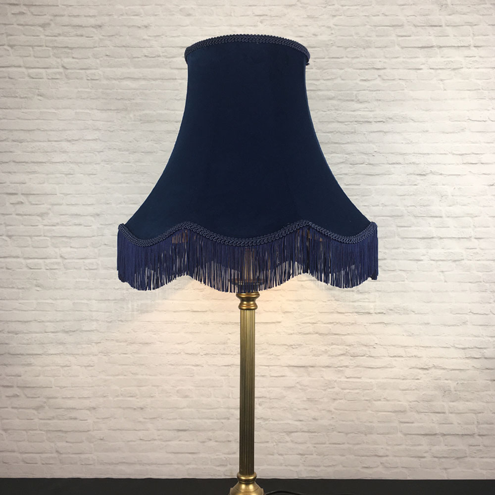 Navy velvet scalloped bowed empire lampshade with navy feather trim on table lamp