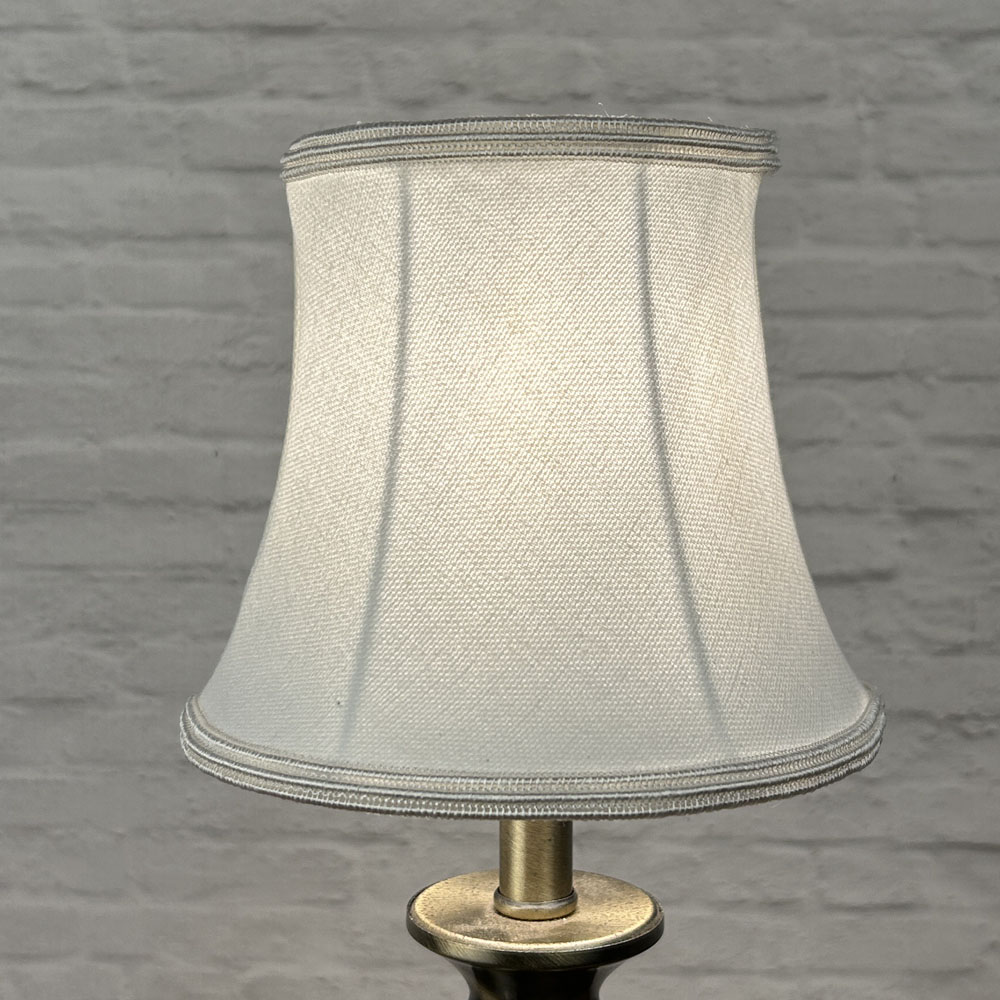 White bowed chandelier shade in brushed cotton lit showing soft glow and white soutache trim