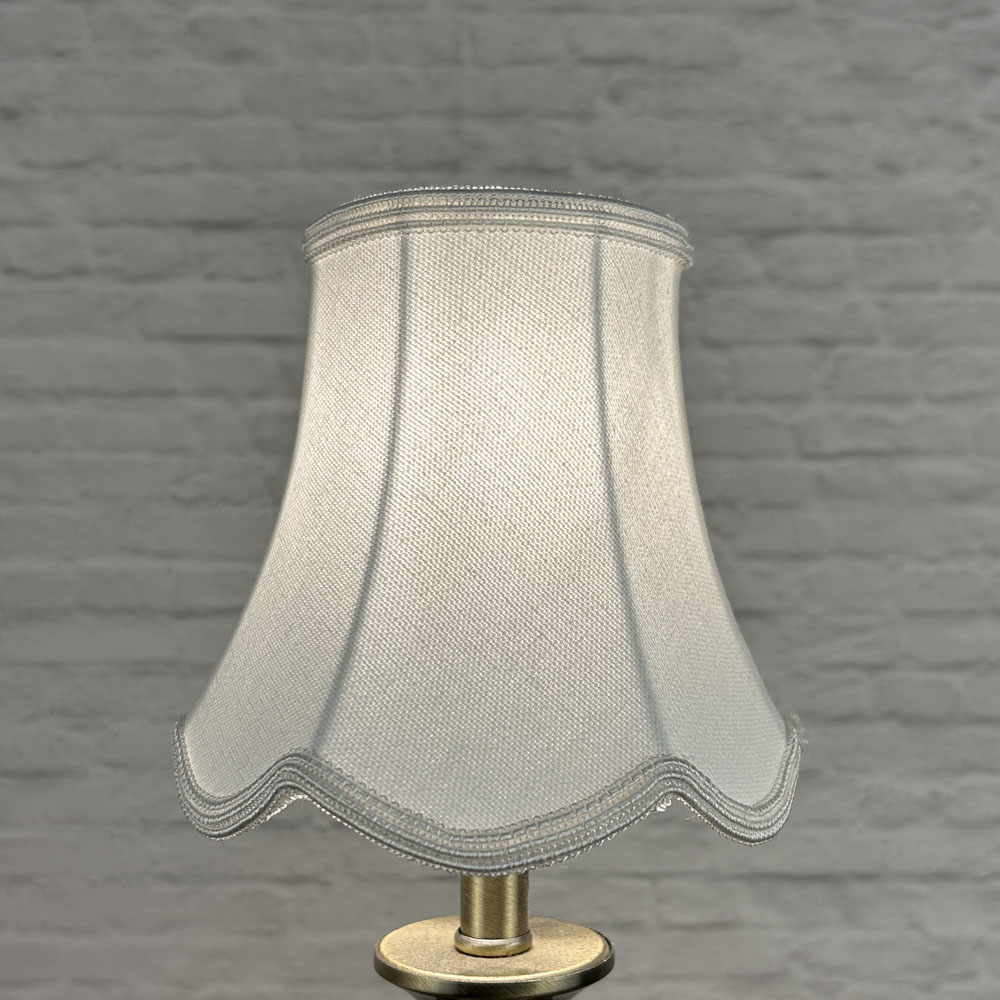 White scalloped chandelier shade in brushed cotton lit showing soft glow and white soutache trim