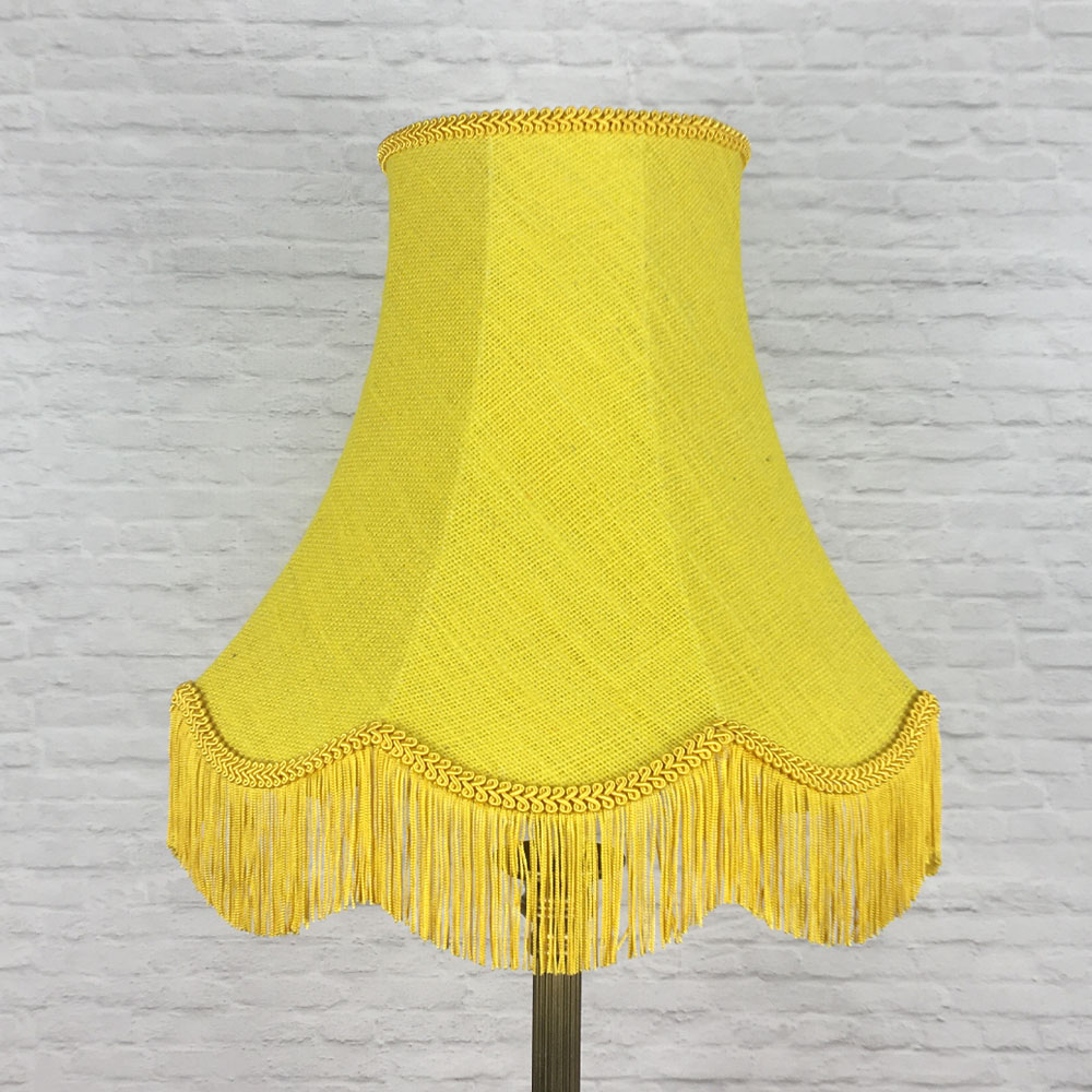 Yellow hessian scalloped bowed empire lampshade on floor lamp